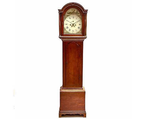 A late George III oak eight day longcase clock. The dial painted with birds to the arch and Classical porticos to the spandre