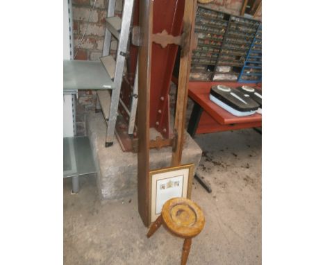 wooden plate shelf, royal garden party invite and a stool