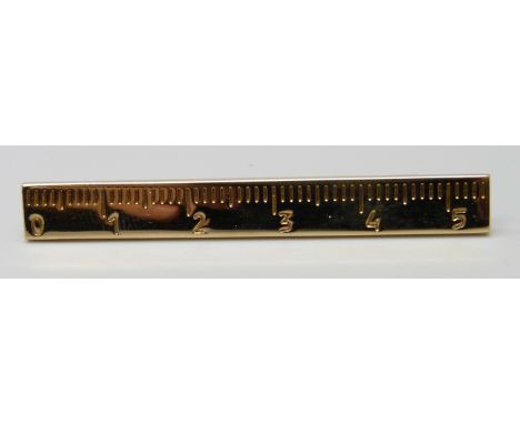 An Yves Saint Laurent tie bar, boxed