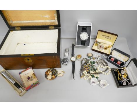 A collection of costume jewellery including faux pearl necklace, mother of pearl cameo brooch, cufflinks, lighter pen and wri