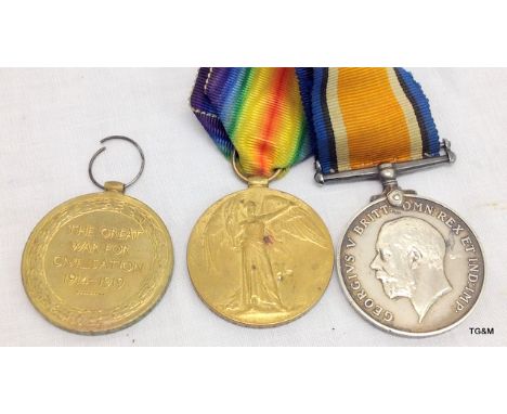 A WW1 medal pair to 152549 Gunner WH Bradshaw of the Royal Artillery with a WW1 Victory medal to 201947 Private FJ Arnold of 