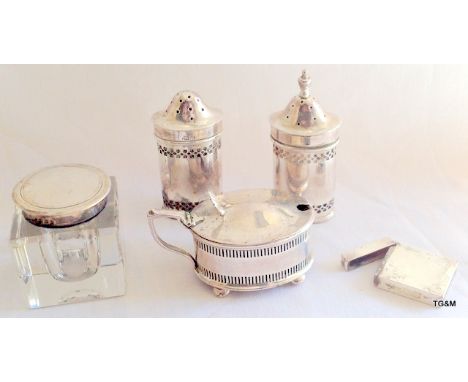 Silver salt and pepper shakers; silver mustard pot; silver topped inkwell; and a vesta case