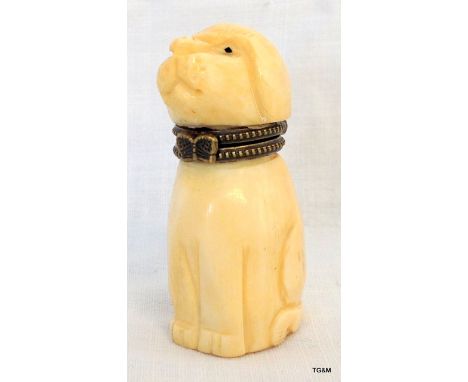 A carved bone snuff bottle in the shape of a dog 5cm high