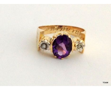 A vintage yellow gold amethyst and diamond ring, size K