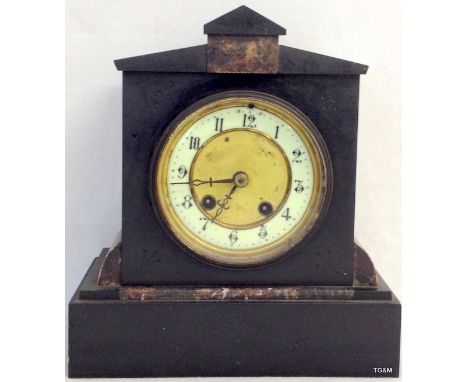 A striking slate mantle clock
