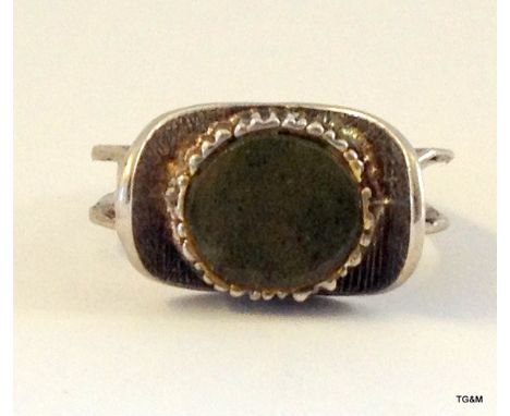 A Chinese silver ring set with jade