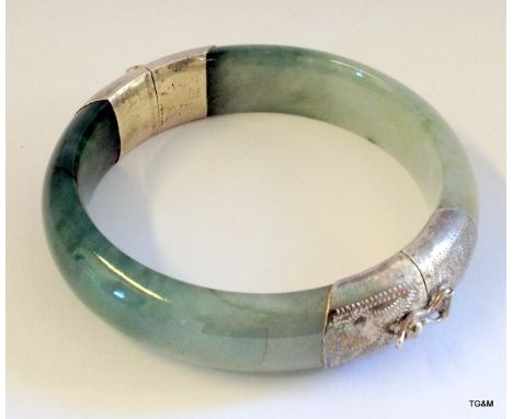 A Chinese silver and jade bangle