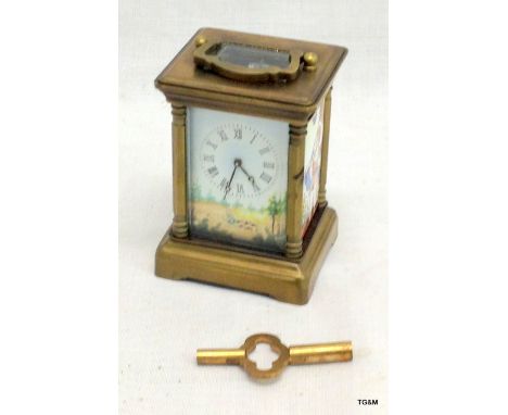 A small picture carriage clock with key 8cm high