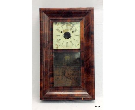 A flame mahogany American wall clock 66h x 39w x 10d