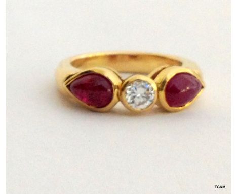 18ct yellow gold ruby and diamond three stone ring, size L/M