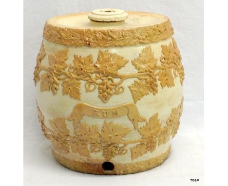 An early ornate ceramic rum decanter by Smith and Co Old Kent Road London in the Doulton style h30 x w27