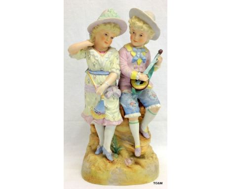 A Victorian Bisque porcelain group circa 1900 35cm high 17cm wide