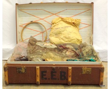 A leather wooden travelling trunk complete with a selection of vintage clothes and material h34 x w92 x d54