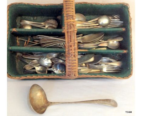 A collection of silver plate flatware including silver/military ladle