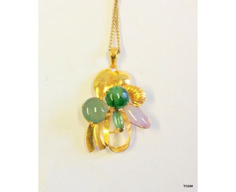 A green/lavender Jade pendant in a 14ct gold mount