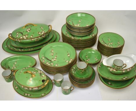 A mid-20th century Japanese part dinner and tea service, jade green ground decorated with cherry blossom and gilt-heightened,