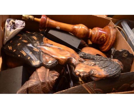A quantity of treen to include a lamp, carved African heads, figures and a pair of ornamental oars.
