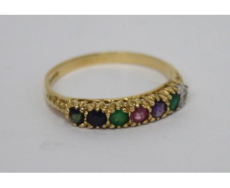 A 9ct gold dress ring, platform set with multicoloured stones, white, green, purple, pink and blue, size P, approx 1.7g.