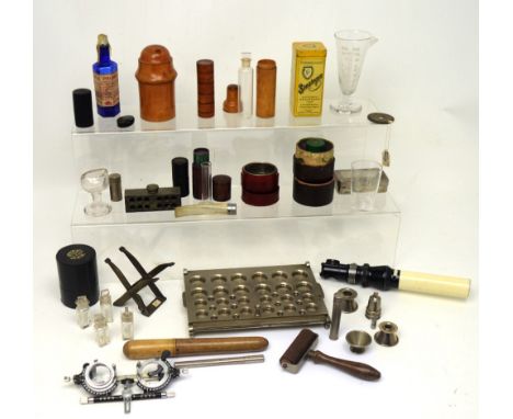 A group of medicinal and scientific instruments and accoutrements to include a cachet (powder) machine, medicinal test tubes 