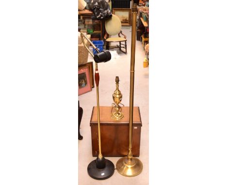 A contemporary brass standard lamp, height 135cm, a floor-standing spot lamp, height when extended 153cm, a brass table lamp,