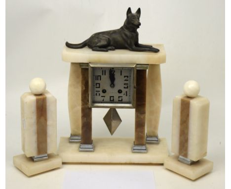 A French 'Le Mans' Art Deco eight-day marble and metal mantel clock garniture, seated dog above square dial set with Arabic n
