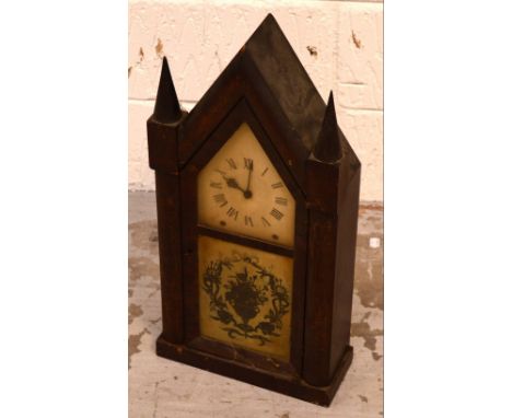 A mahogany-cased mantel clock of ecclesiastical style, the painted dial with Roman numerals above glass panel and floral deco