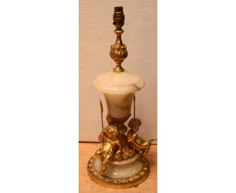 An alabaster and gilt metal figural table lamp and base with three recumbent cherubs, height 51cm.