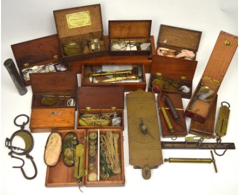 A Stephen Houghton & Son, Ormskirk mahogany-cased pocket guinea/sovereign scale and a group of eleven oak and mahogany-cased 