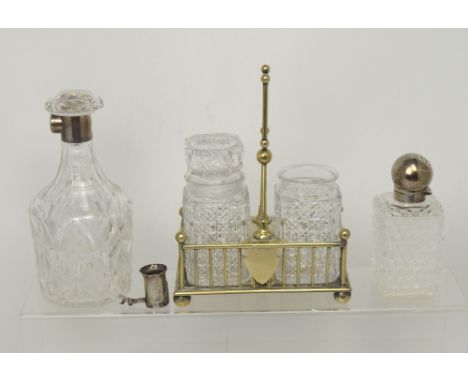 A George V hallmarked silver topped cut glass decanter, Hukin & Heath, Birmingham 1922 (af), a small Victorian silver topped 