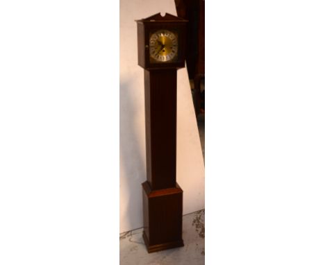 A modern German mahogany-cased longcase clock of small proportions, silvered dial set with Roman numerals against a brass fac