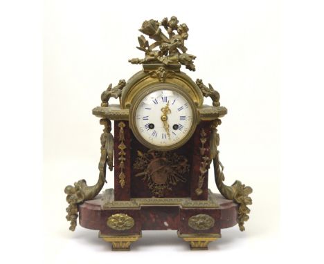 A late 19th century French gilt metal and rouge marble eight-day mantel clock, height 36.5cm.  CONDITION REPORT Rear glass br