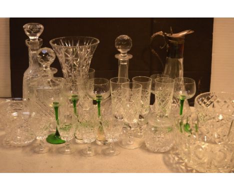 A cut glass ship's decanter with stopper, further decanters, a claret jug and a selection of cut glass.