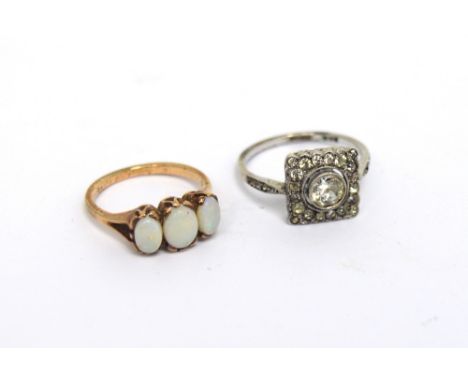 A 9ct gold dress ring set with three graduated opals, size L, approx 2.5g and a white metal Art Deco style ring set with larg