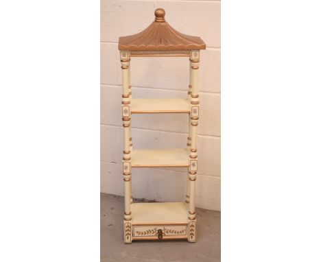 A contemporary pagoda-form painted and gilt three-tier display shelf with single drawer to base, height 95cm.