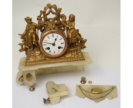 An early 20th century Continental gilt and onyx eight-day mantel clock with figural pastoral decoration, the enamel dial set 