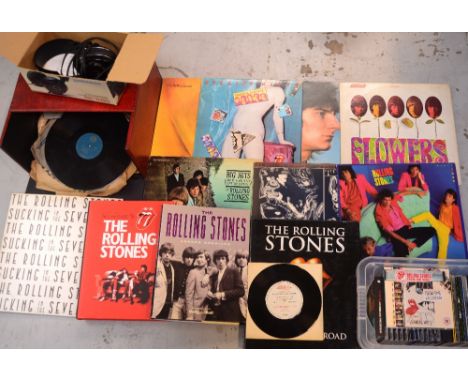 A collection of Rolling Stones memorabilia to include CDs, vinyl, books and a further quantity of unrelated 7" singles.