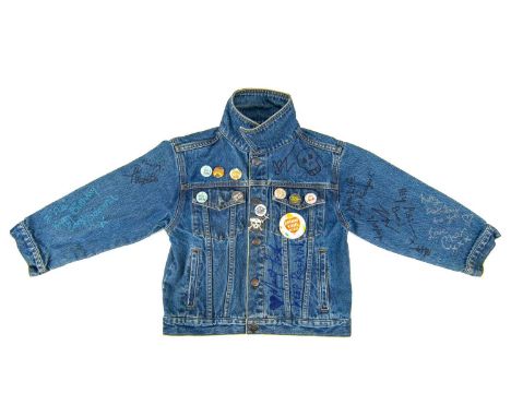 An extensively signed 'Hard Rock Cafe' Las Vegas, denim jacket. Signed by Bono, Brian Johnson, Grace Jones, Bruce Dickenson, 