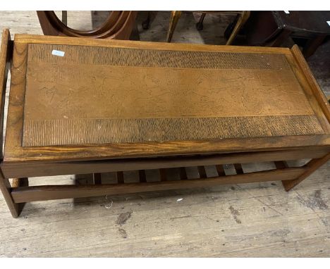 A vintage mid century coffee table with an unusual copper insert to the top. 117cm x 50cm. No shipping. 