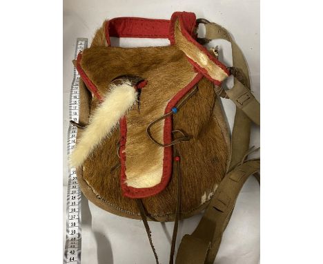 A vintage native Indian style hand sewn hunting shoulder bag made from animal hide 
