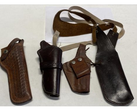 A selection of assorted leather pistol and hunting knife holders/sheaths 