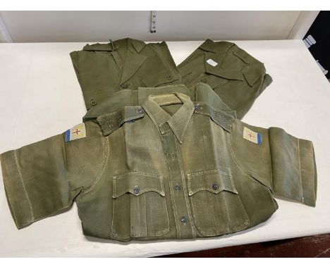 Three 1950s/60s army issue aertex shirts, one with patches for Far East Land Forces