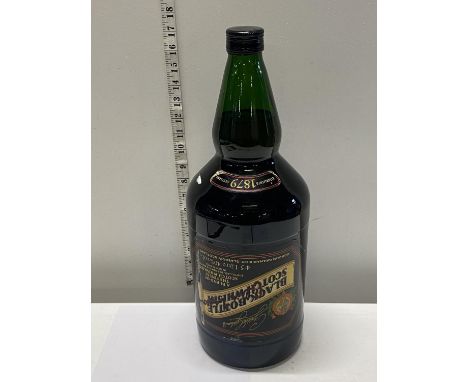 A unopened bottle of Black Bottle Scotch whisky 4.5 litres 1993. Signed by Sir Alex Ferguson and awarded to a Mr J O'Toole. W