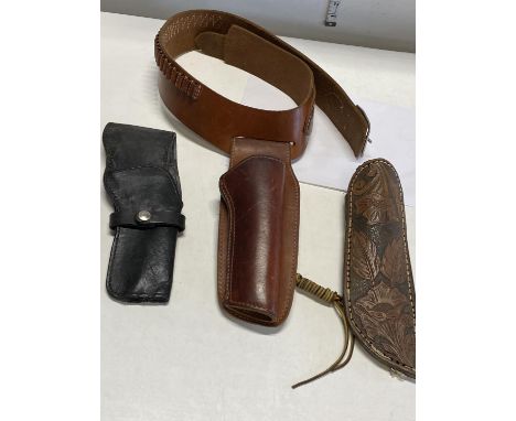 A vintage leather belt and holster and two leather hunting knife sheath's 
