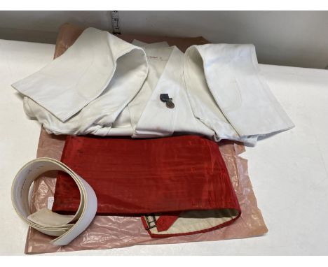 A late WW2/early 1950's army issue dress tunic and cumber band with miniature Malayan medal 