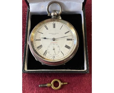 A hallmarked silver pocket watch with key retailed by Harris Stone of Leeds (not running) 