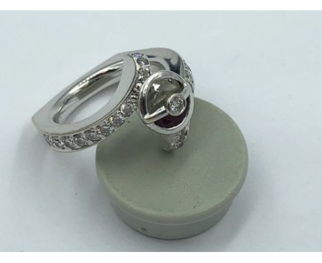 14ct White gold ring, central free cut ruby &amp; diamond set with central diamond half set diamond shoulders on square shank