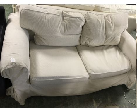 Cream 2 seater sofa upholstered in pincord material 