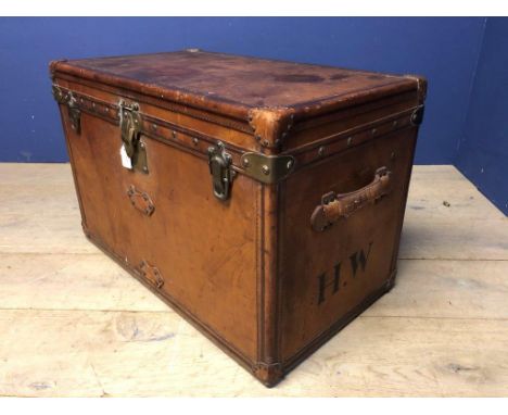 An early C20th leather and brass studded Louis Vuitton Lady's cabin trunk, circa 1903 of rectangular shape with hinged lid an