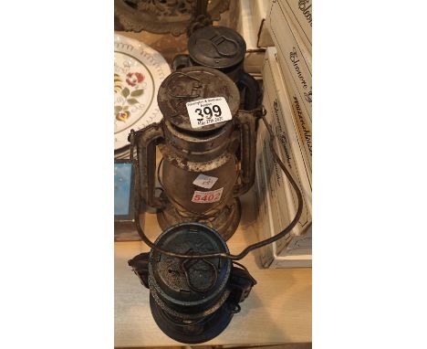 Three vintage hurricane lamps including a Chalwyn. P&amp;P Group 2 (£18+VAT for the first lot and £2+VAT for subsequent lots)