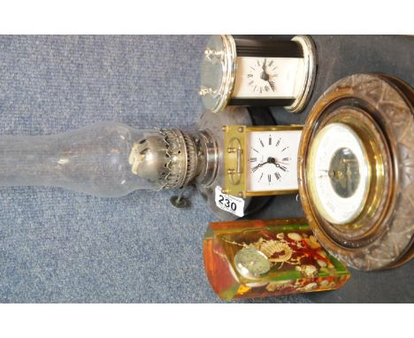 Silver plated and glass antique oil lamp, vintage aneroid barometer, two quartz clocks etc.This lot is not available for in-h